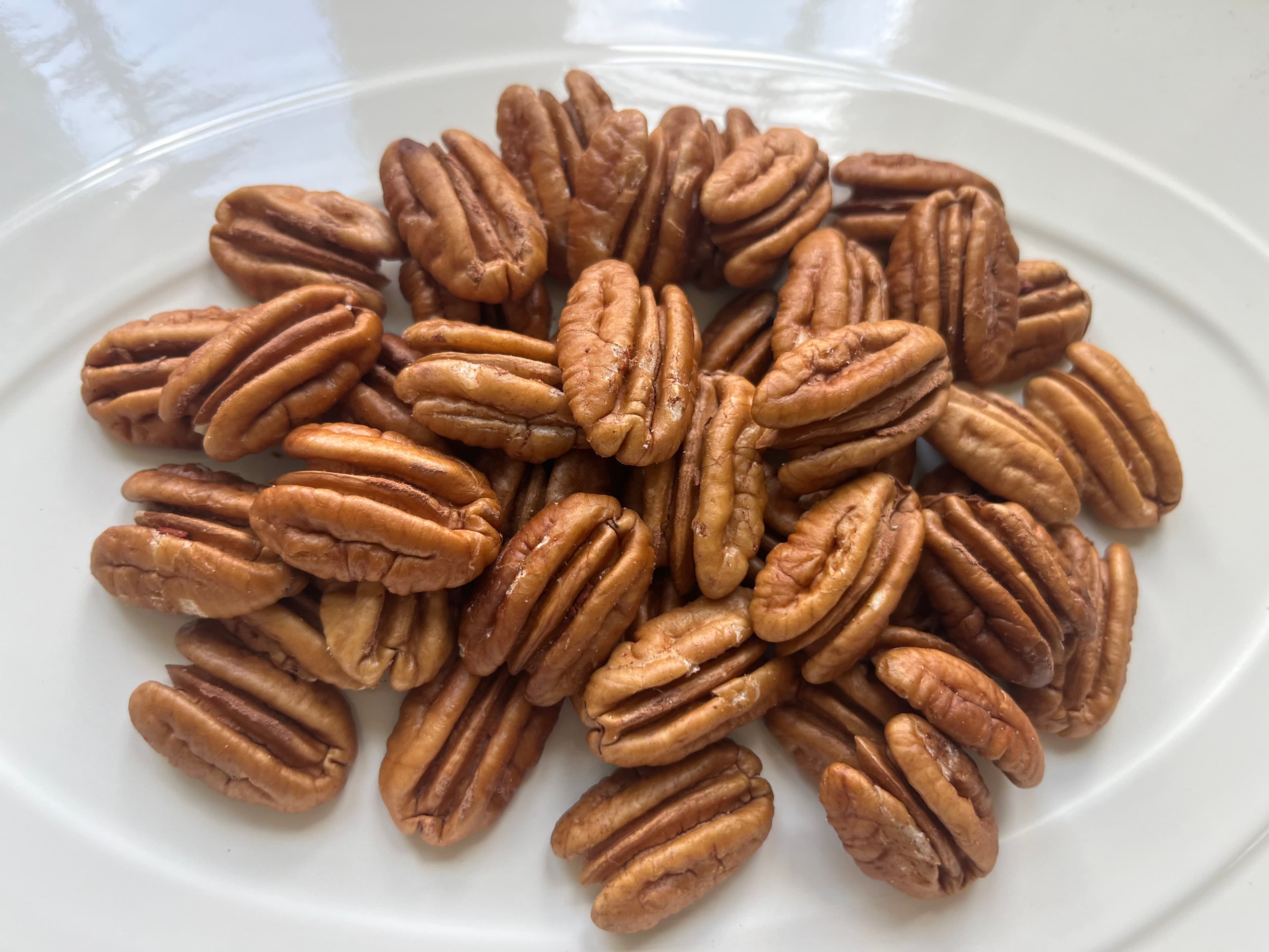 Our golden pecan halves served on a white platter